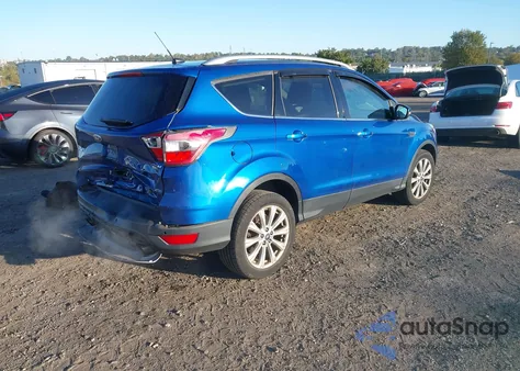 2017 Ford Escape Titanium z USA, uszkodzony, nr VIN 1FMCU9J91HUB57314